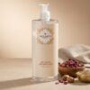 Flacon gel mains désinfectant Belmés Profissional avec pompe – pétales de rose séchés et noix d'argan en arrière-plan