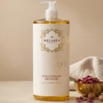 Flacon huile d'argan pure Belmés Profissional 100% naturelle – bol doré marocain avec pétales de rose séchés et noix d'argan en arrière-plan