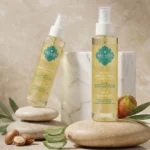 Deux flacons huile réparatrice cheveux Belmés Profissional – noix d'argan aloe vera figue de barbarie et galets naturels en arrière-plan