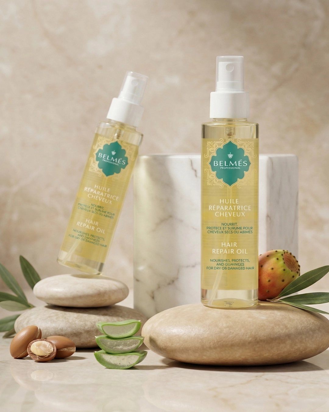 Deux flacons huile réparatrice cheveux Belmés Profissional – noix d'argan aloe vera figue de barbarie et galets naturels en arrière-plan