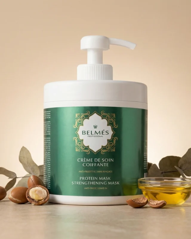 Pot crème de soin coiffante Belmés Profissional anti-frisottis sans rinçage – noix d'argan ouvertes bol d'huile dorée et feuilles d'eucalyptus en arrière-plan