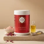 Pot masque argile rose Belmés Profissional – poudre d'argile rose pétales de rose séchés et flacon d'huile dorée en arrière-plan