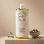 Flacon huile de figue de barbarie Belmés Profissional – graines de figue de barbarie dans bol et fleurs séchées en arrière-plan soin visage corps cheveux